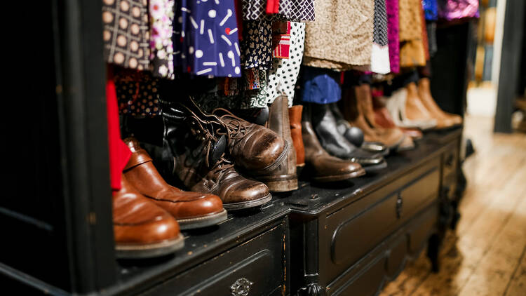 A closet filled with shoes and garment.s