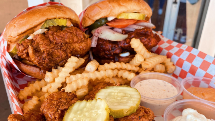 Two chicken sandwiches, fries, tenders and sauces.