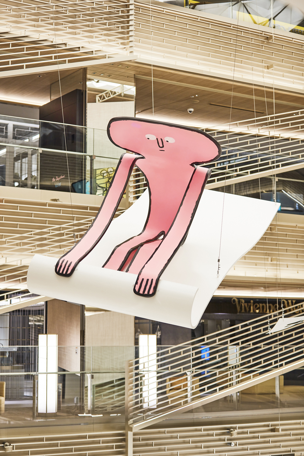 An 8-metre-tall Jean Jullien installation is on show at Ginza Six