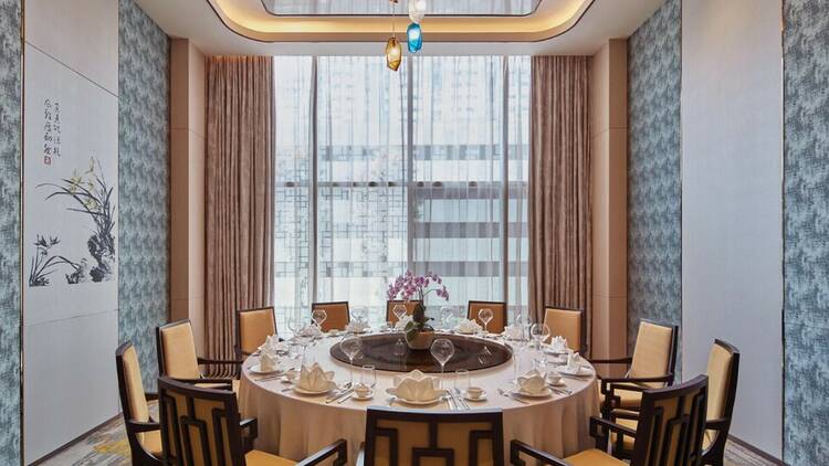 A hotel dining room decorated in an Asian style