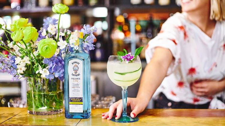 A bartender with Bombay Sapphire gin