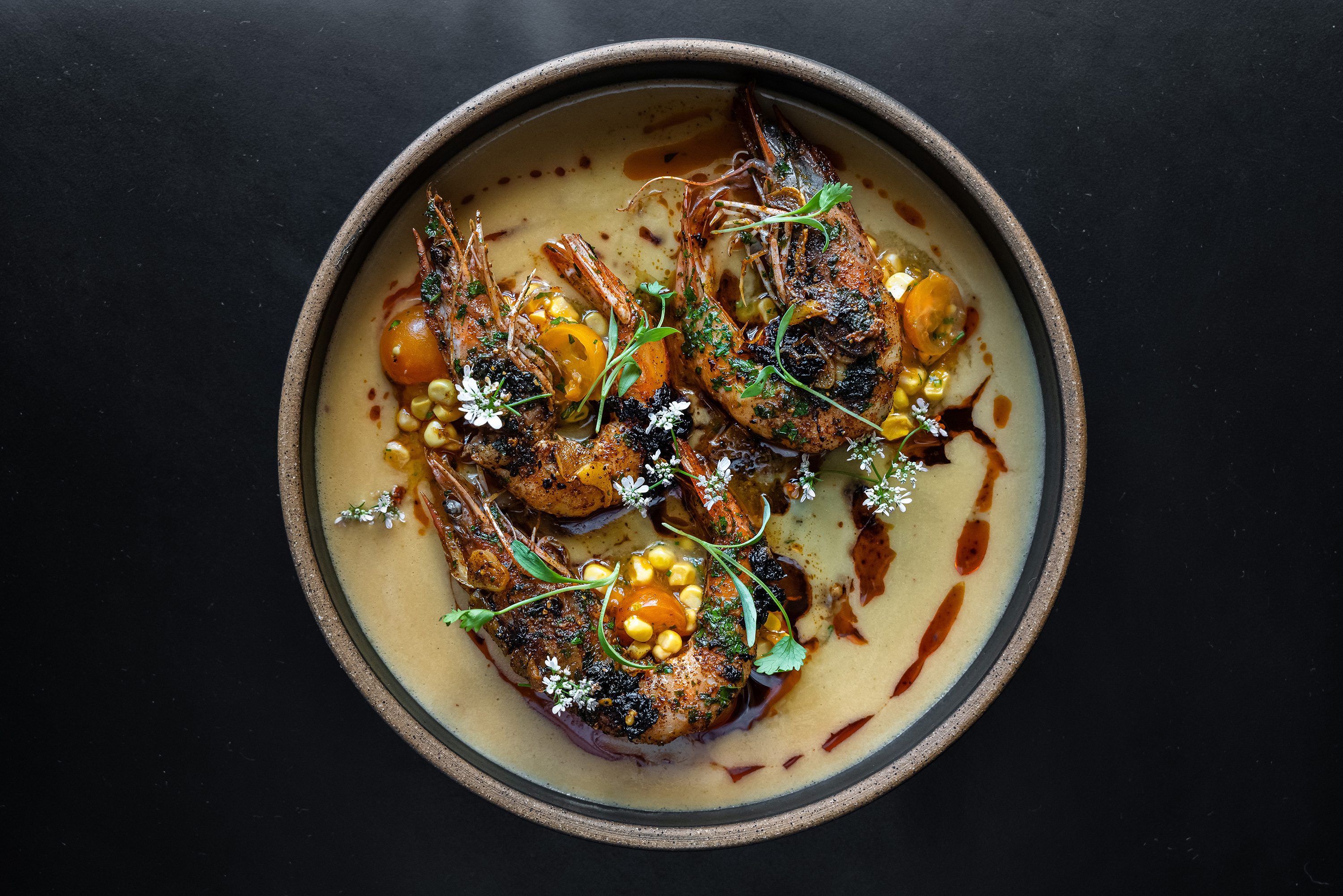 Prawns with Brentwood corn, sungold tomatoes and chile ancho from Asterid by Ray Garica.