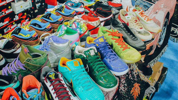 An array of colourful sneakers at a convention.