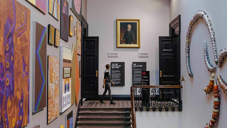 A man wandering through the Art Gallery of Ballarat.