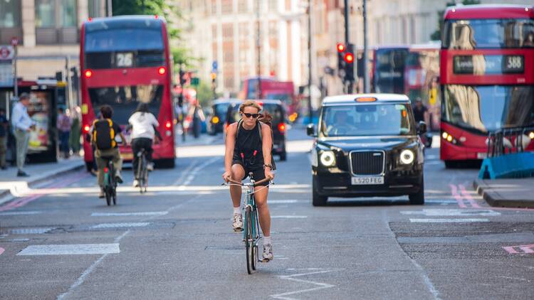 woman cycling in london