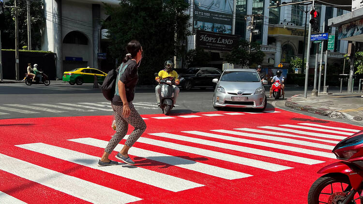 Red zebra crossing at Phra Khanong Intersection