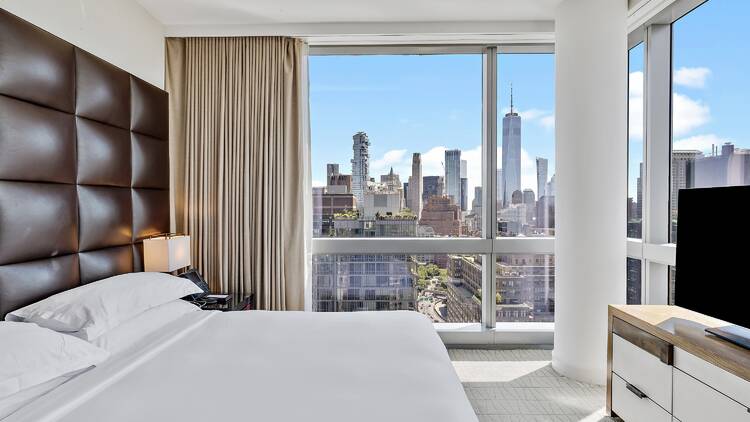 A hotel room with skyline views.