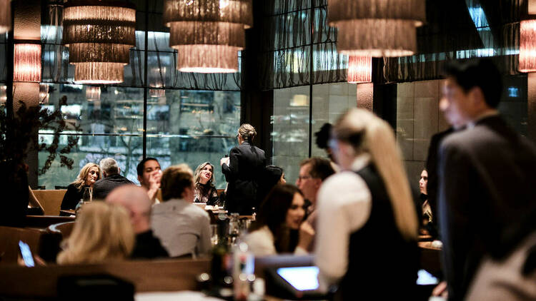 Inside Lillian there are low hung light fittings and a dimly lit room, waiters in waistcoats take diners orders