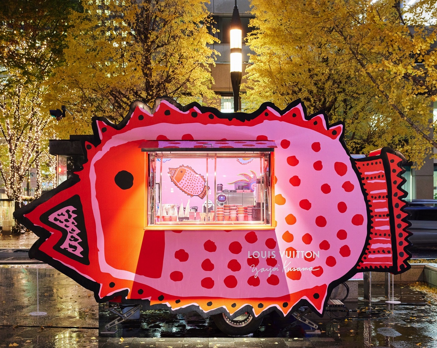 TOKYO, JAPAN - March 5, 2023: Signs and Yayoi Kusama motifs on a building  containing a Louis