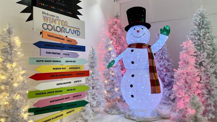 A snowman statue greets visitors to the Color Factory.