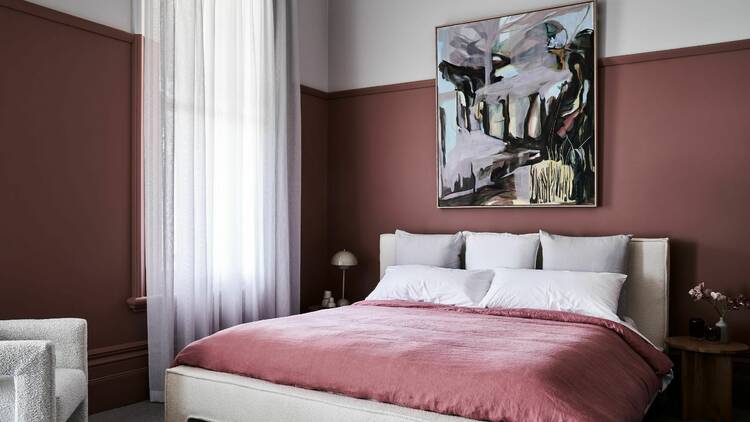 A pink-themed room within the Hotel Vera.