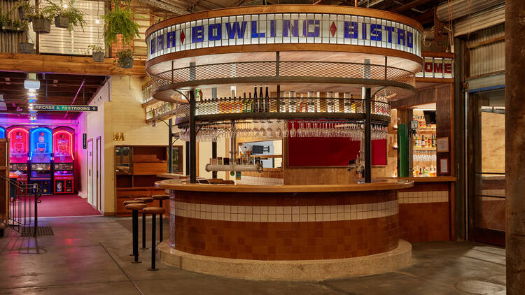 There is a round bar with the words "bowling" and "bistro" in large letters at the top 