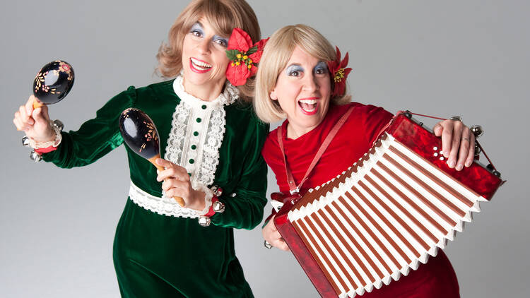 Vickie and Nickie pose for a photo in holiday outfits. 