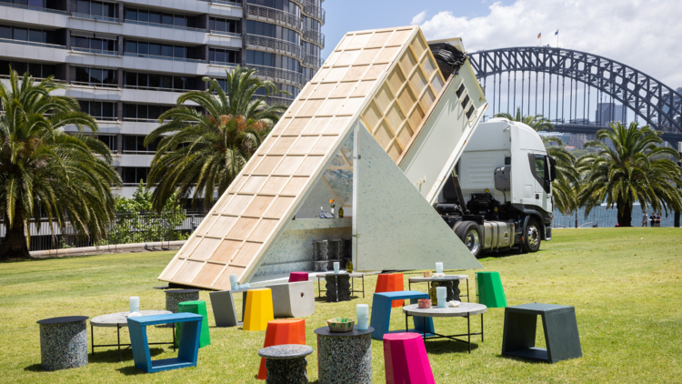 A pop-up truck bar on a lawn in front of Harbour Bridge