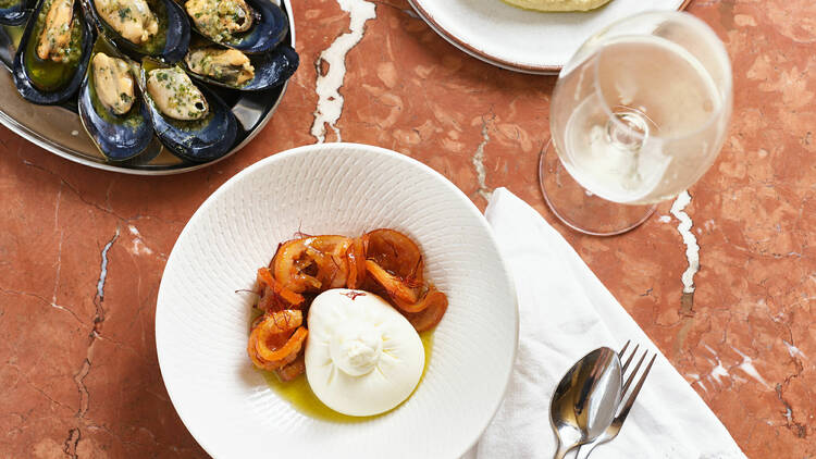 Food pictured on plates on a table.