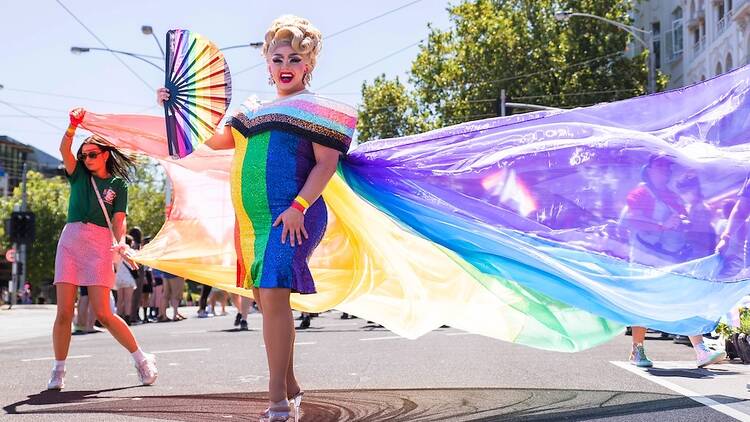 drag queen with rainbow celebrating pride