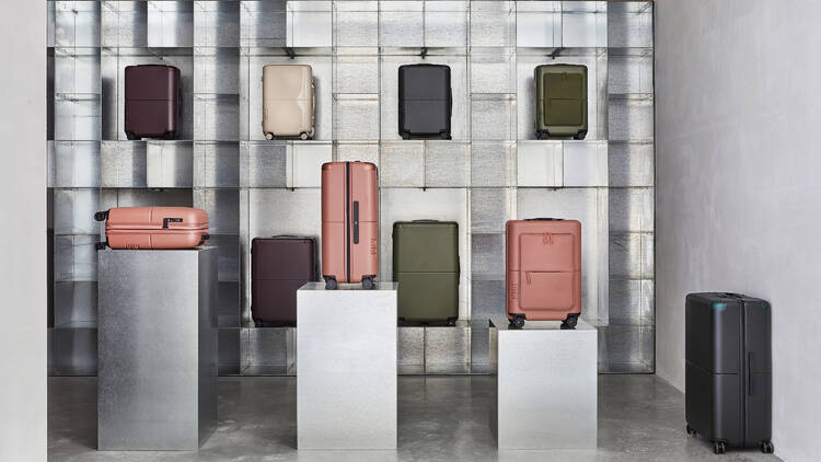 A variety of colours of luggage by the brand July.