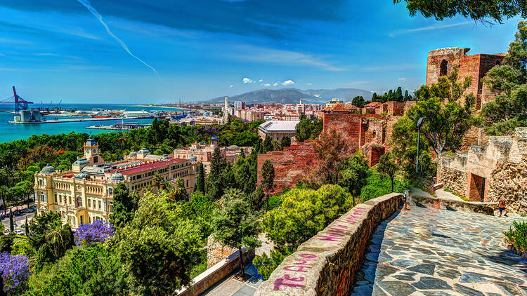 Aerial view of Malaga taken from Gibralfaro castle including port of Malaga, Alcazaba castle and the Cathedral, Andalucia, Spain.