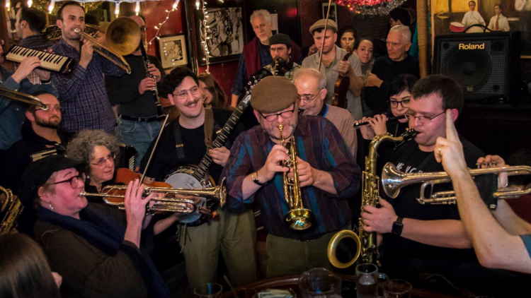 People play instruments as part of a Yiddish New York event.