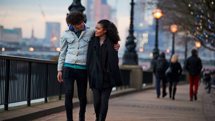 A couple walking along the Southbank