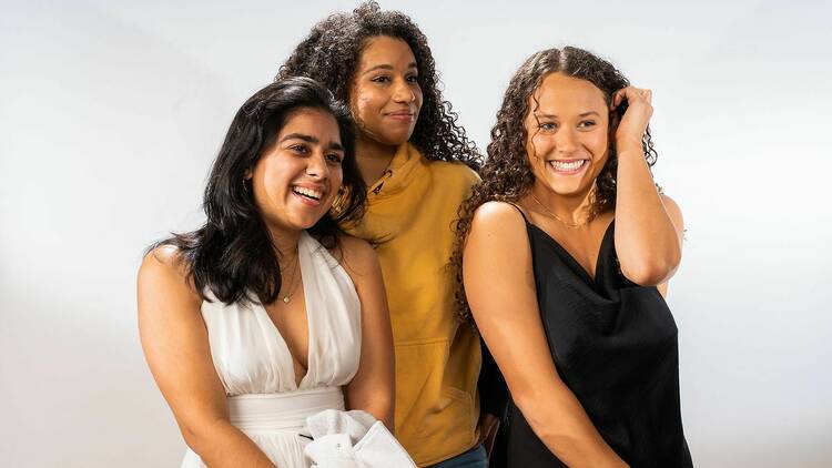 Three women posing for a photo.