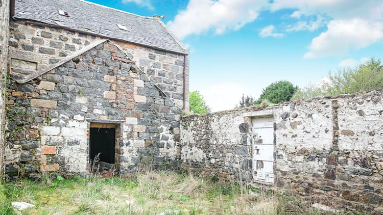 Watermill home from the exterior, with grass at bottom