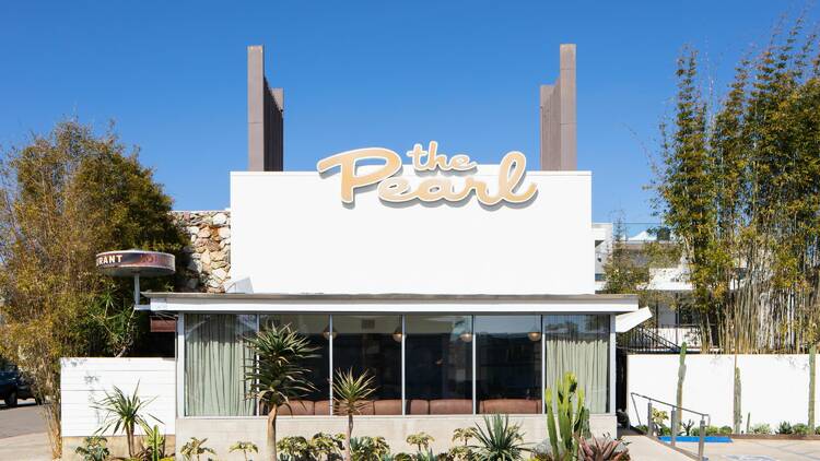 The facade of the Pearl shows its mid-century Modern architecture with clean lines