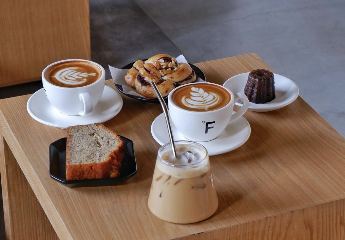 Two Coffee Cups On Wood Table In Cafe Interior Stock Photo