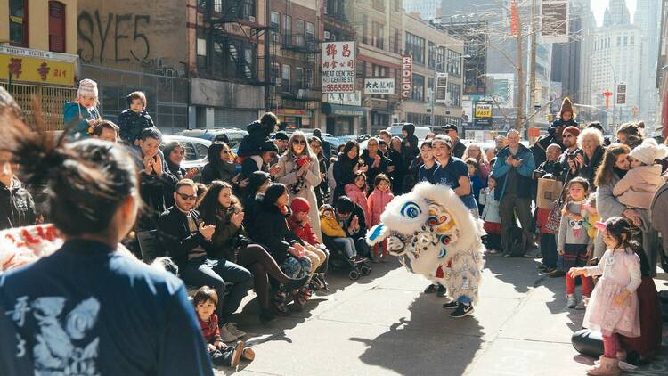 People gather around during the annual lion dance.