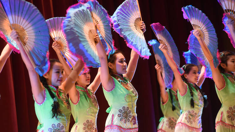 Dancers perform with colorful fans at The Met.