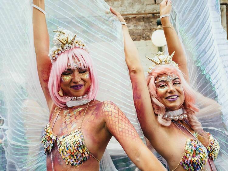 picture of two girl mermaids at a pride party