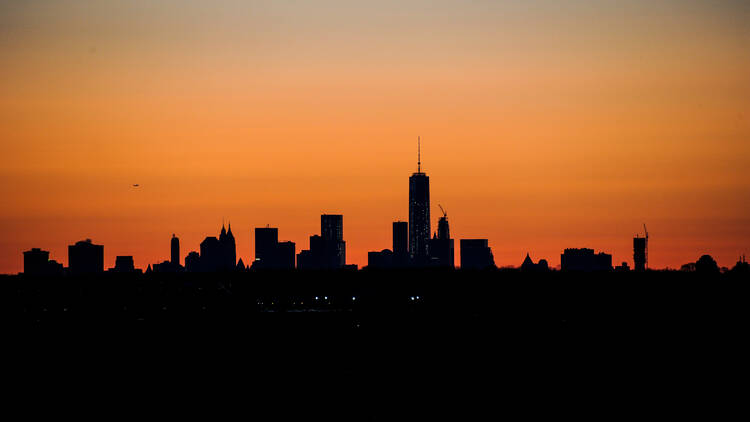 The sun sets over NYC. 