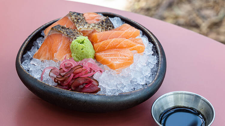 Tanuki Raw - free salmon sashimi slices for every year