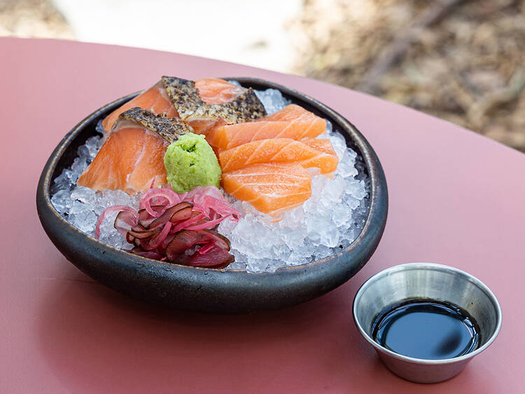 Tanuki Raw - free salmon sashimi slices for every year