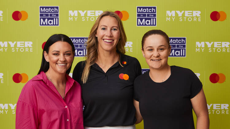 tennis star ash barty standing alongside two mastercard ambassadors