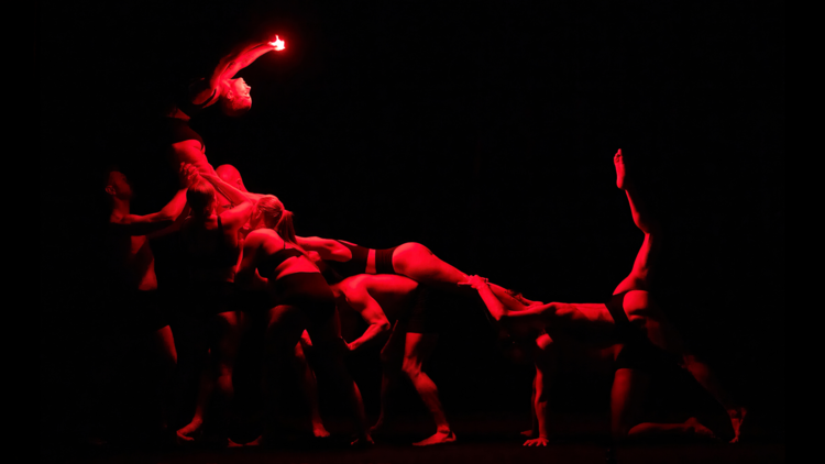 Circus performers doing an acrobatic routine