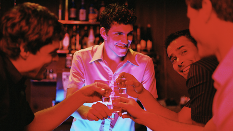 Four men at a bar. 
