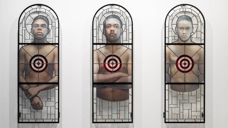 An artwork with portraits on stained glass windows