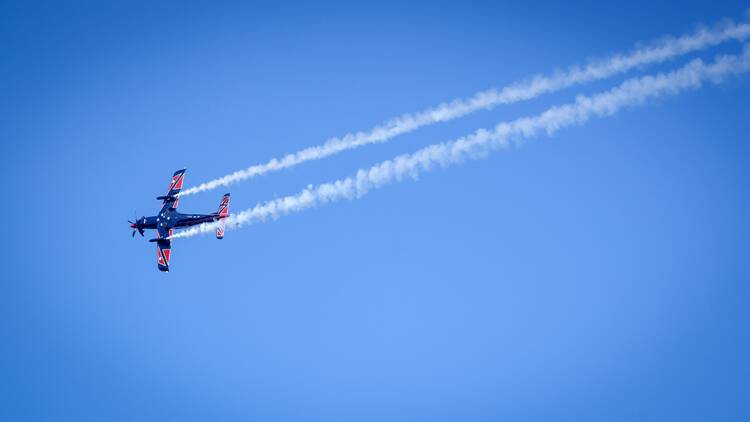 A plane flying through the sky.