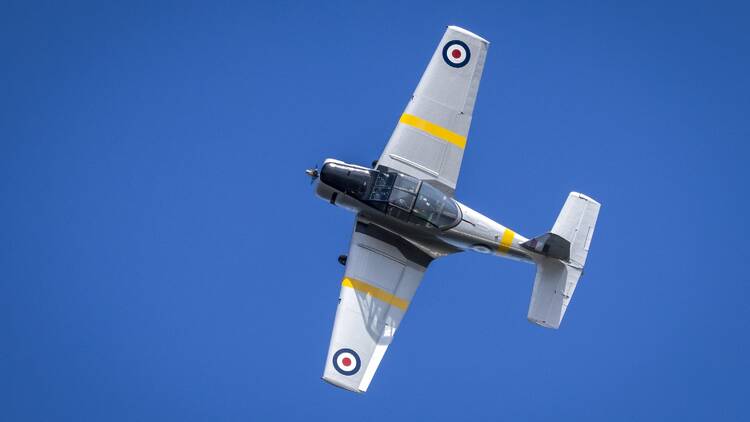 A plane flying through the air.