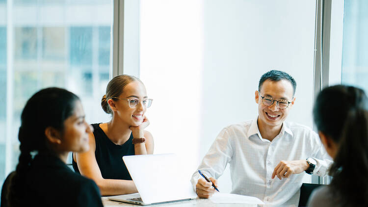 A group of people working in an office.