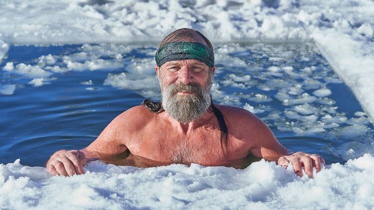 Wim Hof smiling while being in ice water