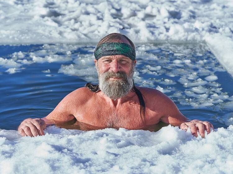 Wim Hof smiling while being in ice water