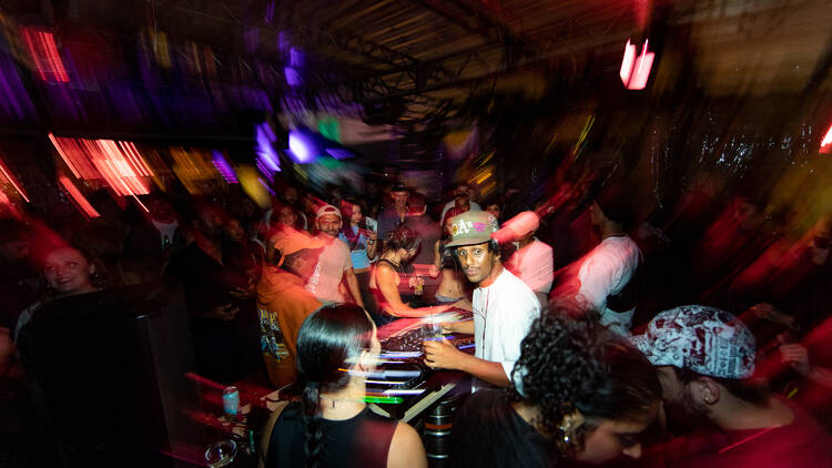 A blurred image of a DJ at Section 8. 