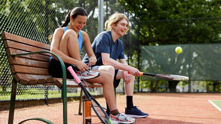 Two friends about to play tennis