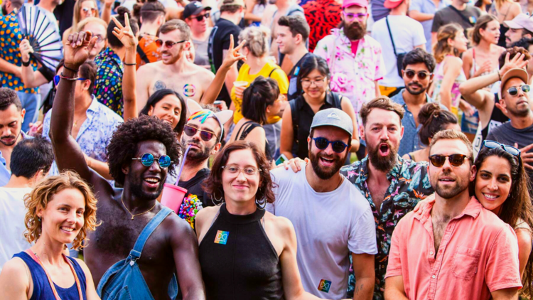 A crowd celebrates at Mardi Gras Fair Day