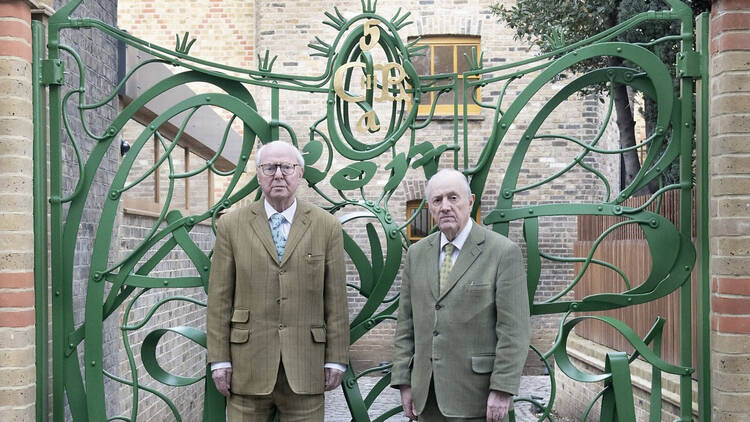 Gilbert & George outside the Gilbert & George Centre. Photo by Yu Yigang, courtesy Gilbert & George