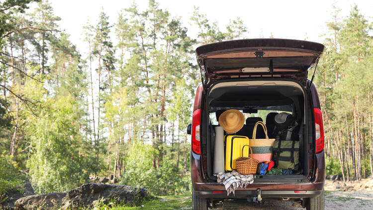 A van packed with items for camping.