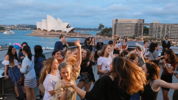 Young people dancing on the roof of the MCA