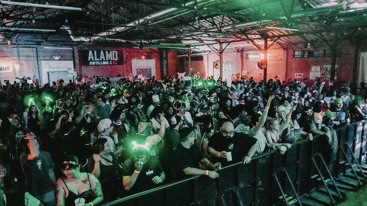 People raving in a warehouse